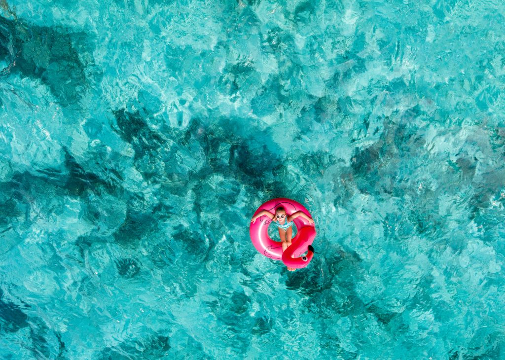 Floating in turquoise waters of Maldives